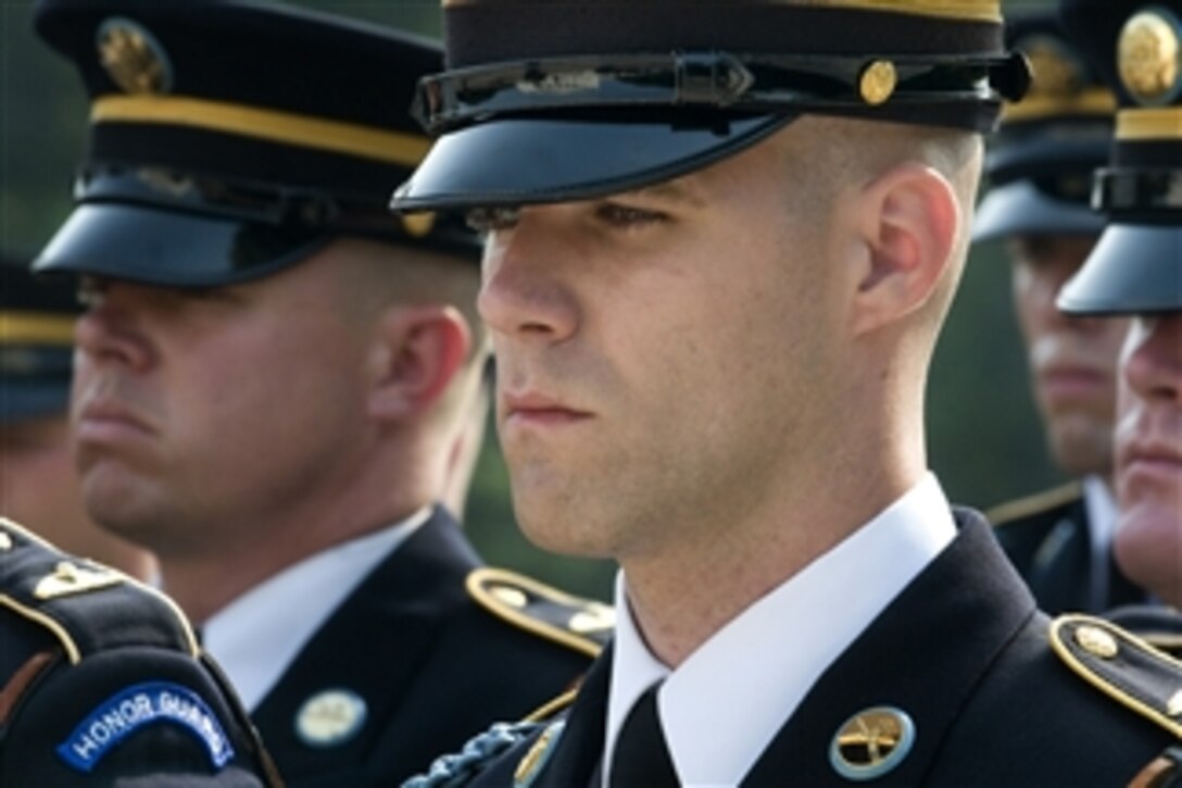 U.S. Army soldiers with the 3rd U.S. Infantry Regiment (The Old Guard) stand at attention for taps during the Army's 233rd birthday tribute at Arlington National Cemetery in Virginia on June 14, 2008.  The event commemorates June 14, 1775, the day the Continental Congress founded the Continental Army following the beginning of the American Revolution.  