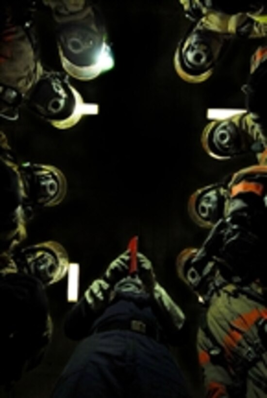 U.S. Navy sailors from repair locker one bravo discuss firefighting techniques prior to engaging a simulated fire casualty during a general quarters drill aboard the Nimitz-class aircraft carrier USS John C. Stennis (CVN 74) while underway in the Pacific Ocean on June 15, 2008.  