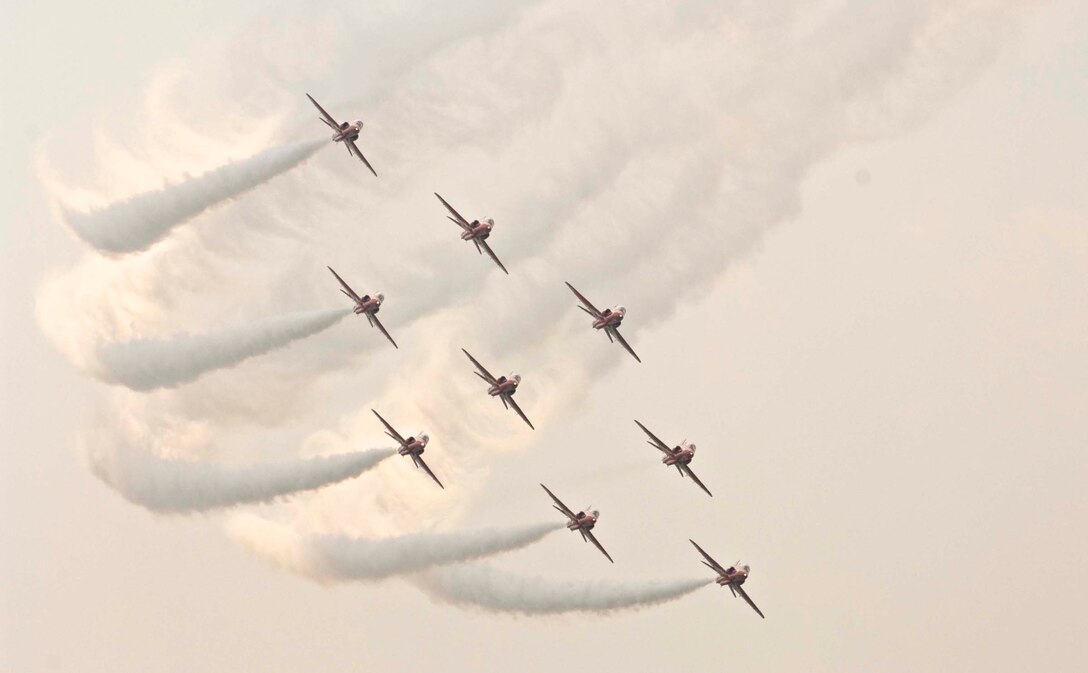 LANGLEY AIR FORCE BASE, Va. – The Royal Air Force Red Arrows fly in formation during AirPower over Hampton Roads here June 21. Langley’s open house is an annual event that helps educate the public, increase recruiting and show appreciation to the local community. “It's a chance to get people informed, involved and excited,” said Lt. Col. Brady Merrill, director of AirPower over Hampton Roads and chief of 1st Fighter Wing Plans, Programs and Evaluations. (U.S. Air Force photo/Senior Airman Barry Loo)  