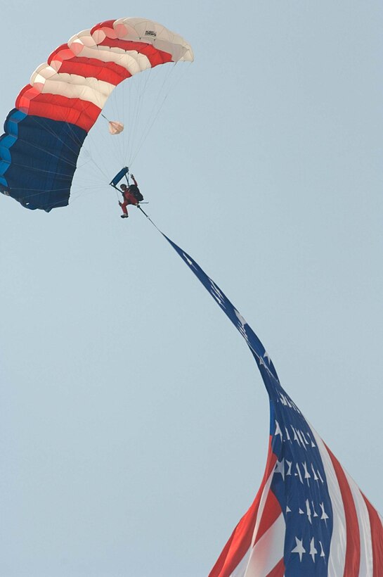LANGLEY AIR FORCE BASE, Va. – An E Team skydiver displays the American flag during AirPower over Hampton Roads here June 21. Langley’s open house is an annual event that helps educate the public, increase recruiting and show appreciation to the local community. (U.S. Air Force photo/Senior Airman Barry Loo)
