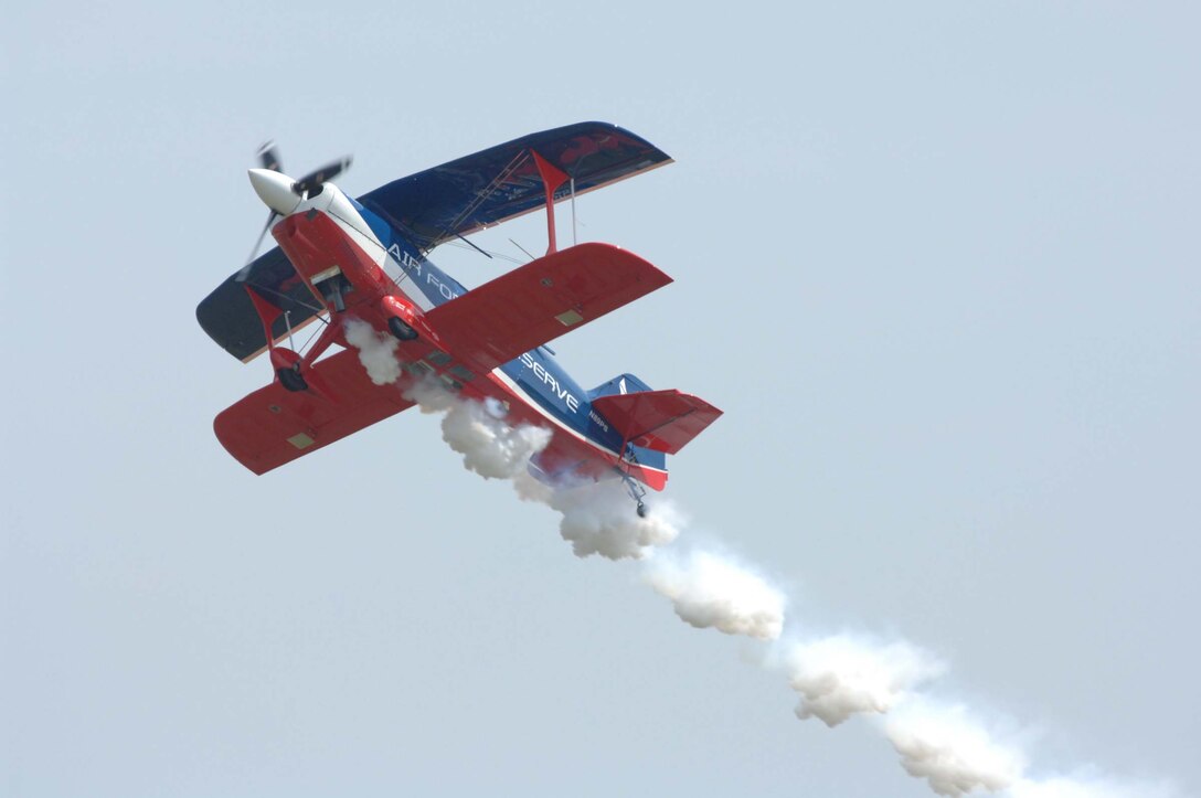 LANGLEY AIR FORCE BASE, Va. – Ed Hamill  flies  a biplane during AirPower over Hampton Roads  June 21.  Langley’s open house is an annual event that helps educate the public, increase recruiting and show appreciation to the local community.  “It's a chance to get people informed, involved and excited,” said Lt. Col. Brady Merrill, director of AirPower over Hampton Roads and chief of 1st Fighter Wing Plans, Programs and Evaluations. (U.S. Air Force photo/Senior Airman Barry Loo).