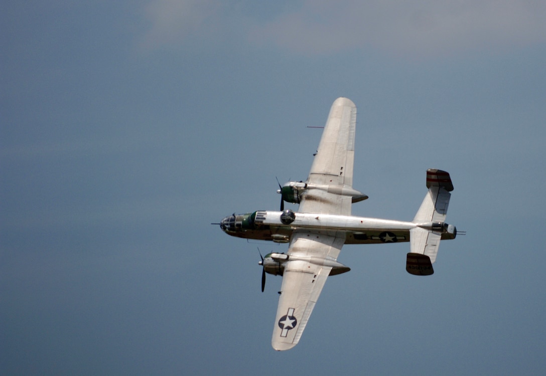 LANGLEY AIR FORCE BASE, Va. - The Disabled American Veterans' B-25 Panchito flies over the crowd during AirPower over Hampton Roads here June 21. Langley’s open house is an annual event that helps educate the public, increase recruiting and show its appreciation to the local community. “It's a chance to get people informed, involved and excited,” said Lt. Col. Brady Merrill, director of AirPower over Hampton Roads and chief of 1st Fighter Wing Plans, Programs and Evaluations. (U.S. Air Force photo/Tech. Sgt. Levi Collins)