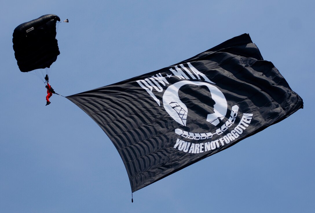 LANGLEY AIR FORCE BASE, Va. - An E Team skydiver displays a POW/MIA flag during AirPower over Hampton Roads here June 21. Langley’s open house is an annual event that helps educate the public, increase recruiting and show appreciation to the local community. (U.S. Air Force photo/Tech. Sgt. Levi Collins) 