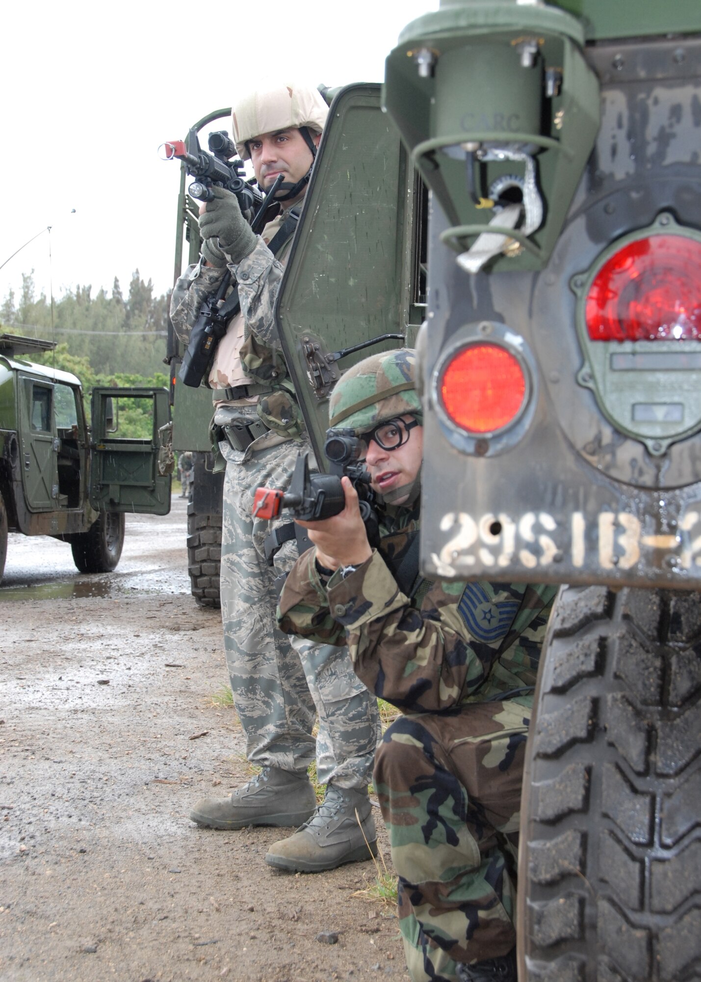 Technical Sgts. Joel Loranger (left) and Richard Aceves, members of the 163d  Reconnaissance Wing Security Forces Squadron, standby for action during a  dismount exercise.  (U.S. Air Force photo by Staff Sgt. Diane Ducat)