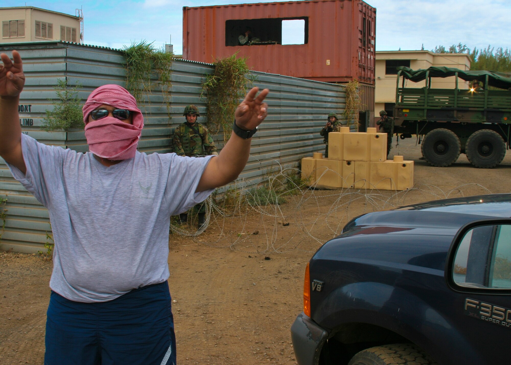 Staff Sgt. Luis Robles, 163d Transportation Flight, masquerades as a terrorist during
a field training exercise in Hawaii. The “terrorist” was captured after tormenting the outer defenses of the forward operating base the members of the 163d Security Forces Squadron were defending.  (U.S. Air photo by Senior Airman Paul Duquette)