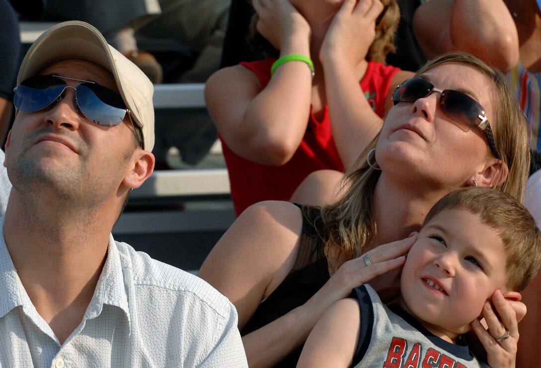 LANGLEY AIR FORCE BASE, Va. -- A family gazes high into the sky during the F-15 Eagle aerial demonstration during AirPower over Hampton Roads June 20. The base annually conducts the open house to inform the public, increase recruiting and to show appreciation to the local community. (U.S. Air Force photo/Senior Airman Vernon Young)