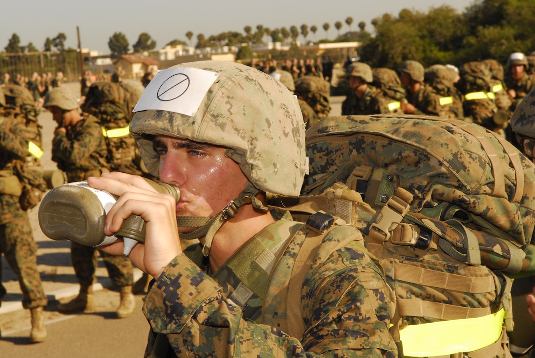 Recruit Bradley S. Davis, Platoon 2129, Company F, takes a drink from his canteen during one of the breaks on the depot hike.