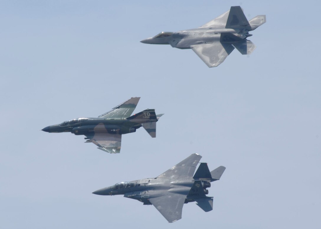 LANGLEY AIR FORCE BASE, Va. -- An F-22A Raptor, F-4 Phantom II and F-15 Eagle perform an Air Force Heritage Flight at Airpower over Hampton Roads June 21. Langley’s open house is an annual event that helps educate the public, increase recruiting and show appreciation to the local community. (U.S. Air Force photo/Airman 1st Class Jonathan Koob)