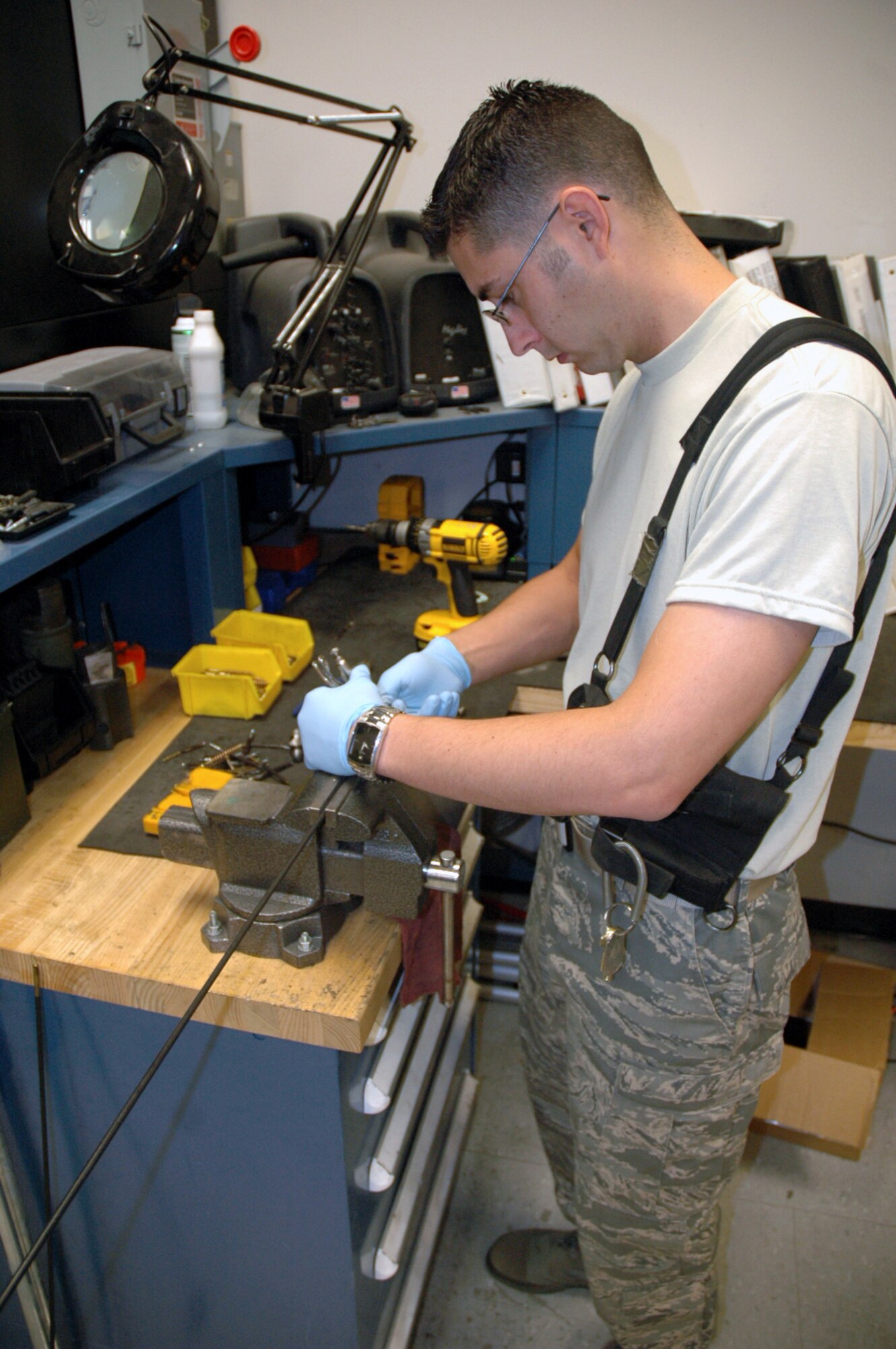 Staff Sgt. Ryan Marcotte, U.S. Air Force Expeditionary Center armory, works on repairing gun cleaning equipment inside the armory June 19, 2008, on Fort Dix, N.J.  The USAF EC's armory is one of the largest in the Air Force and holds the Air Force's largest inventory of foreign weapons on the U.S.' East Coast.  Largely, the Center's weapons are used for training in numerous expeditionary field courses.  (U.S. Air Force Photo/Tech. Sgt. Scott T. Sturkol)