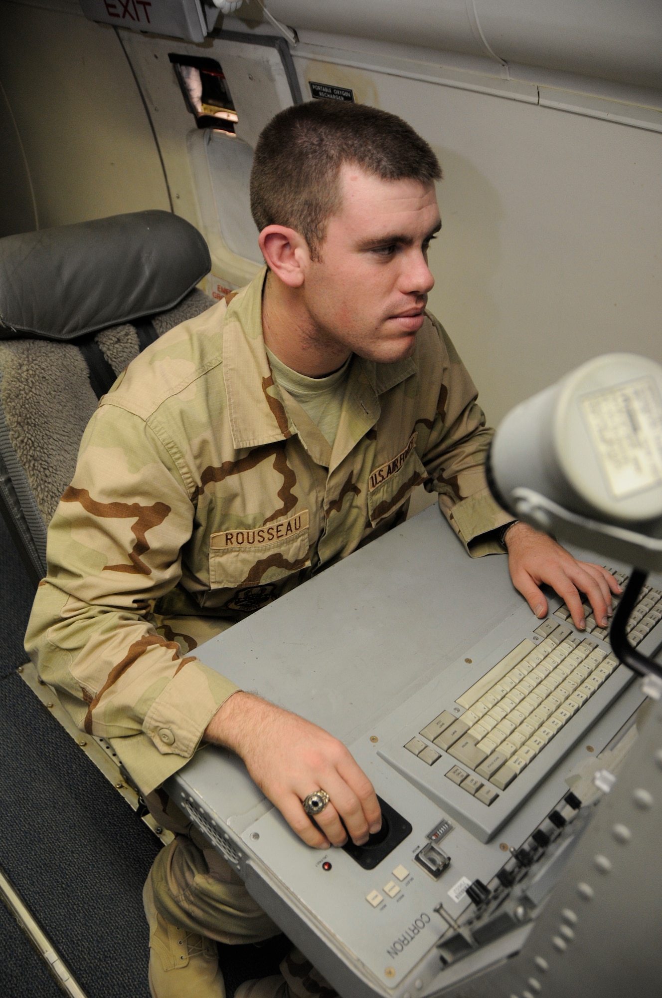SOUTHWEST ASIA-- Air Force Academy cadet Shawn Rousseau familiarizes himself with a workstation aboard a Rivet Joint airframe June 19. Cadet Rousseau graduates from the Air Force academy in May 2009 aspiring to be an A-10 pilot. (U.S. Air Force photo/ Senior Airman Domonique Simmons)