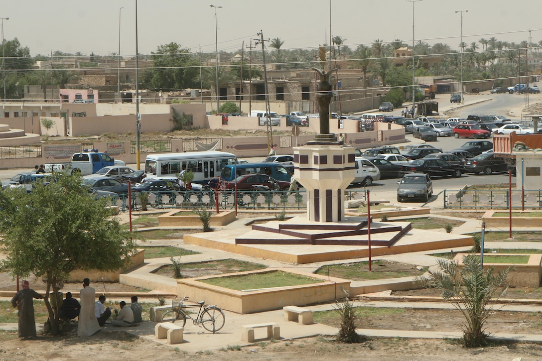 The statue of a bird and globe, meant to represent peace, sits in the middle of a park in the bustling downtown district of Ramadi June 22. "We decided to place a statue with a bird and a globe in front of the building," said Mahmoud Marre, a local Iraqi contractor. "The new statue is meant to be a symbol of peace in Ramadi, a new chapter for the city. In the past Saddam's face was at that site. It was meant to instill fear in us and remind us that he is an enemy of peace. We removed the old statue as a way out saying this is the new Ramadi, free of Saddam and free of violence."