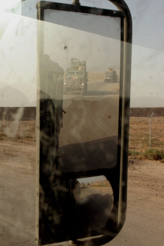 A convoy of Motor-T Marines leaves Habbaniyah, Iraq to re-supply infantry companies in their area of operations (AO) May 22. The Combat Trains of 2nd Battalion, 24th Marine Regiment, Regimental Combat Team 1, have traveled more than 9,000 miles to over 20 different locations in their AO during their five months in Iraq.