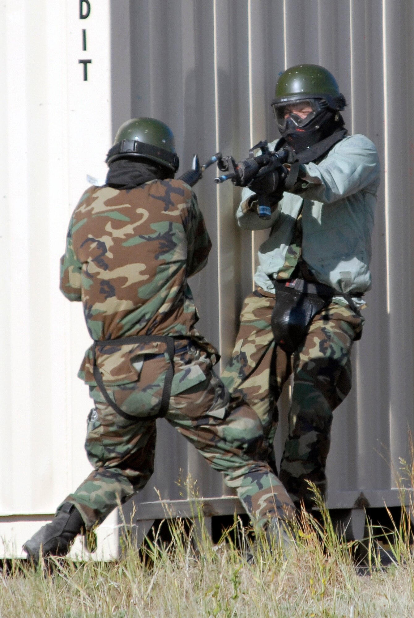 A U.S. Air Force Academy cadet (left) is on the offensive against would-be attackers in the Military Operations Urban Terrain village during the 71-day summer training schedule June 19 at the Academy in Colorado. Approximately 1,200 Academy cadets are going through intensive training this summer to be ready to be globally engaged when they graduate. (U.S. Air Force photo/Mike Kaplan) 
