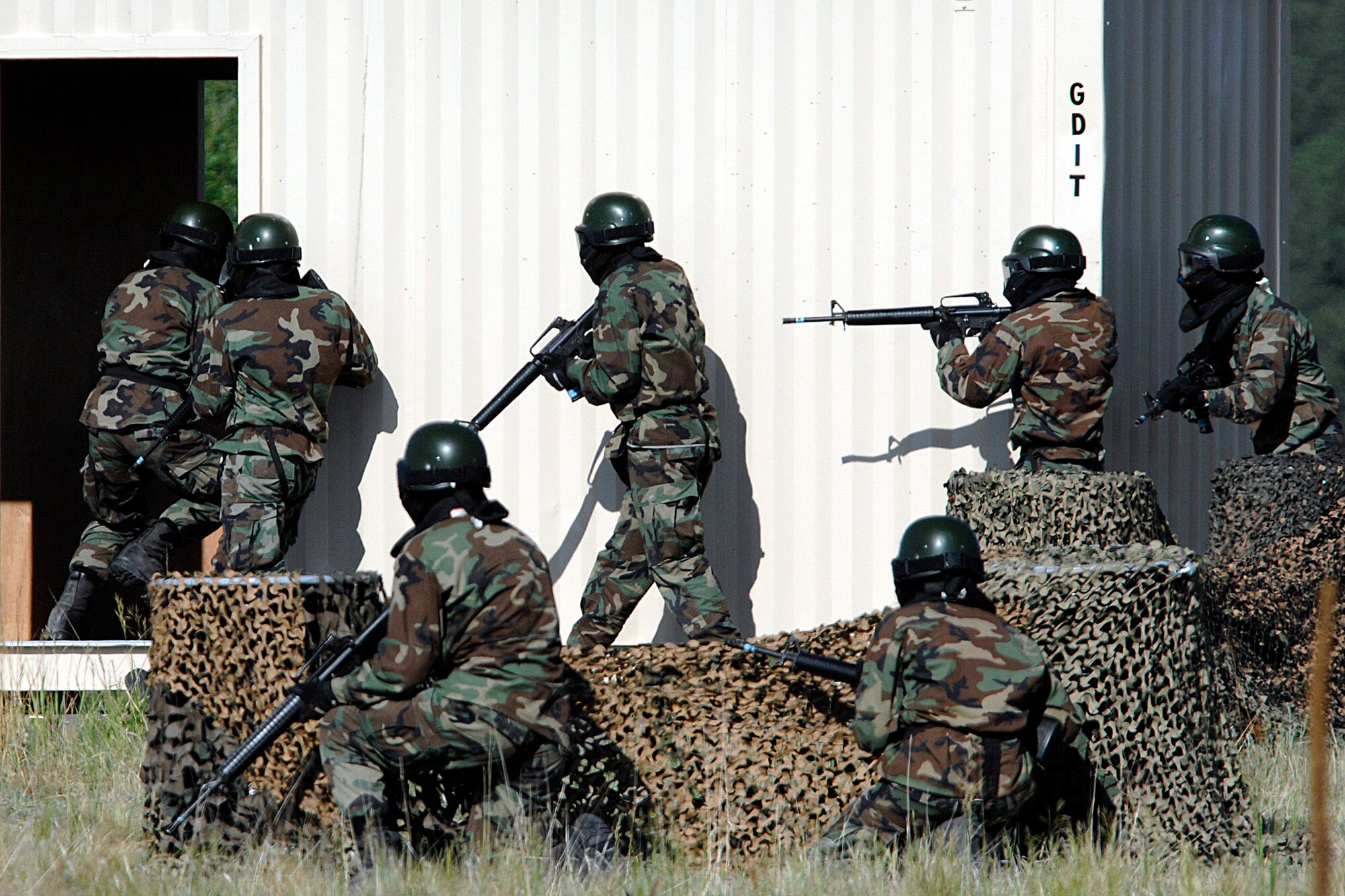 The Global Engagement assault team readies to enter the Military Operations Urban Terrain village during the 71-day summer training schedule June 18 at the U.S. Air Force Academy in Colorado. Approximately 1,200 Academy cadets are going through intensive training this summer to be ready  to be globally engaged when they graduate. (U.S. Air Force photo/Dave Ahlschwede) 
