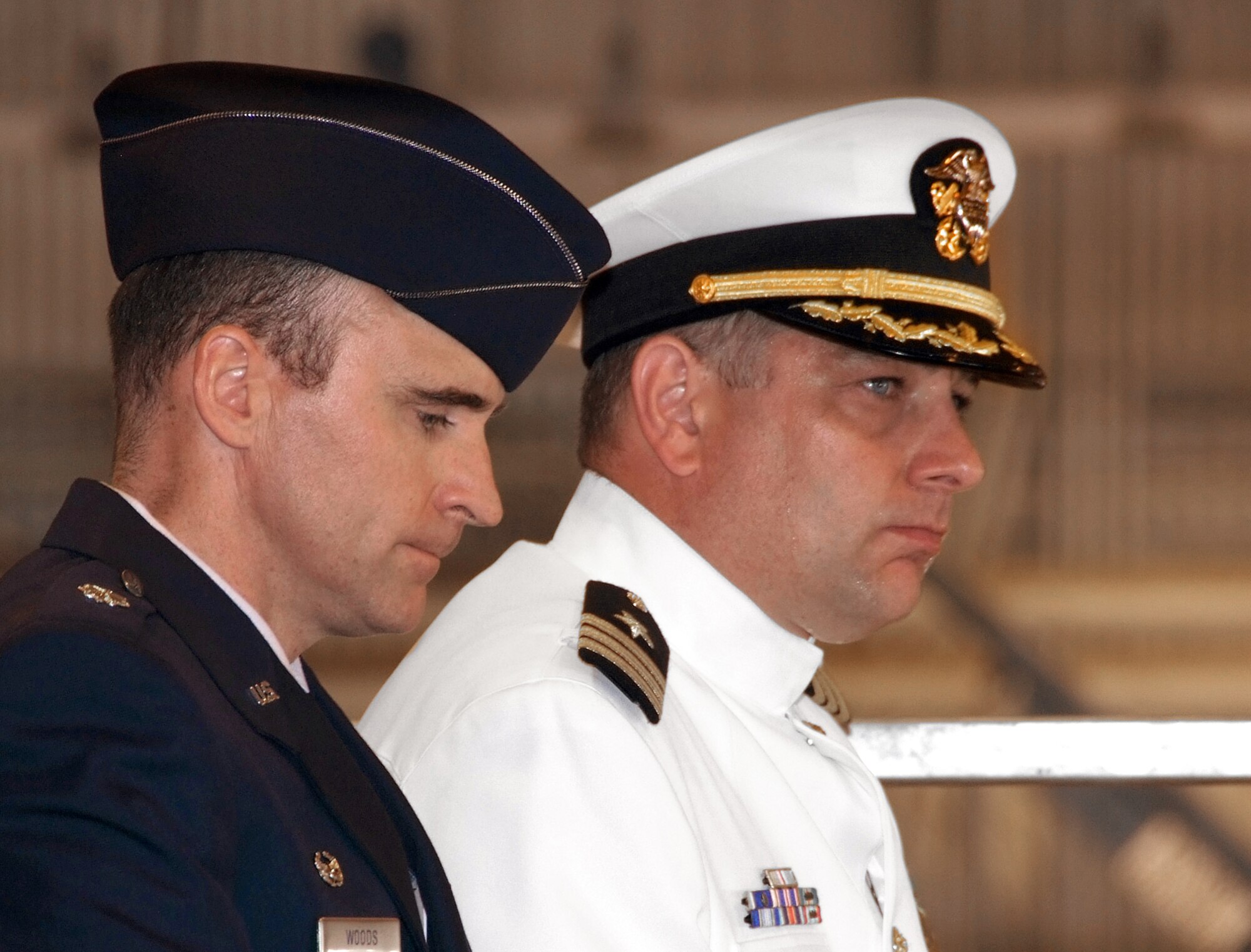 Air Force Lt. Col. Neil E. Woods, left, and Navy Cmdr. Roger L. Curry, have a quiet moment during their change of command ceremony, June 20, at Vance AFB, Okla. Colonel Woods relinquished command of the 8th Flying Training Squadron to Commander Curry. (U.S. Air Force photo by Terry Wasson)