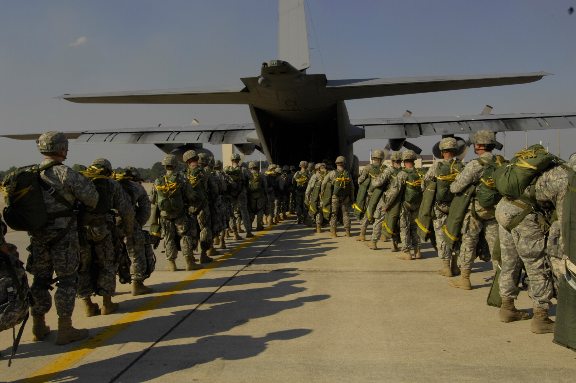 U.S. Army paratroopers board a U.S. Air Force C-130 Hercules during Joint Forcible Entry Exercise at Pope Air Force Base, N.C., on June 17, 2008. JFEX is a joint airdrop exercise designed to enhance service cohesiveness between U.S. Army and Air Force personnel, allowing both services an opportunity to properly execute large-scale heavy equipment and troop movement. (U.S. Air Force photo by Senior Airman Ali E. Flisek) 