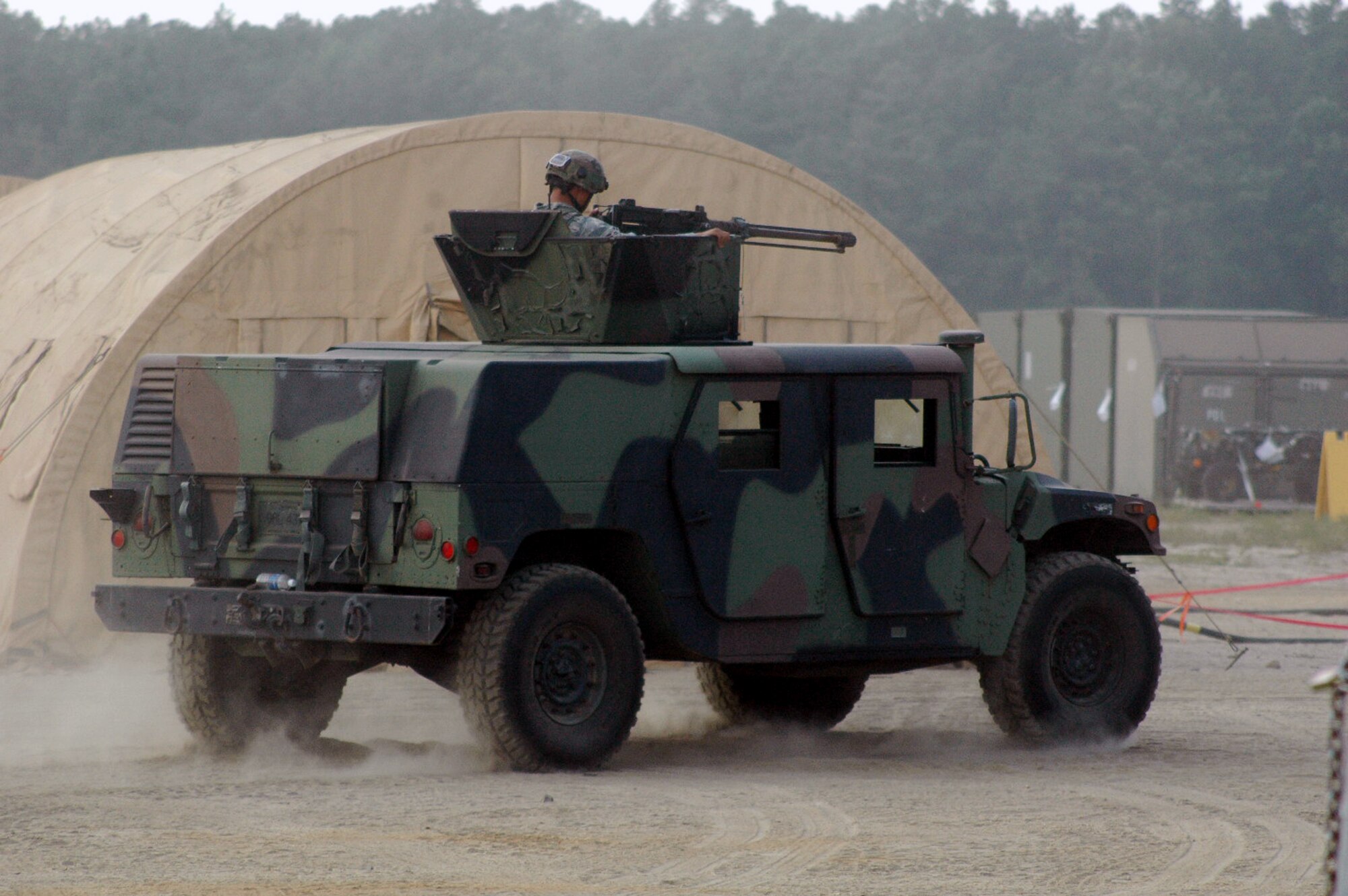 Airmen with the 574th Contingency Response Group, Travis Air Force Base, Calif., move out for a mounted patrol as part of Air Force Exercise Eagle Flag 08-5 June 21, 2008, at Naval Air Engineering Station Lakehurst, N.J.  Eagle Flag is operated by the U.S. Air Force Expeditionary Center's Expeditionary Operations School and the 421st Combat Training Squadron at Fort Dix, N.J.  The exercise tests and trains Airmen in expeditionary combat support skills.  (U.S. Air Force Photo/Tech. Sgt. Scott T. Sturkol)