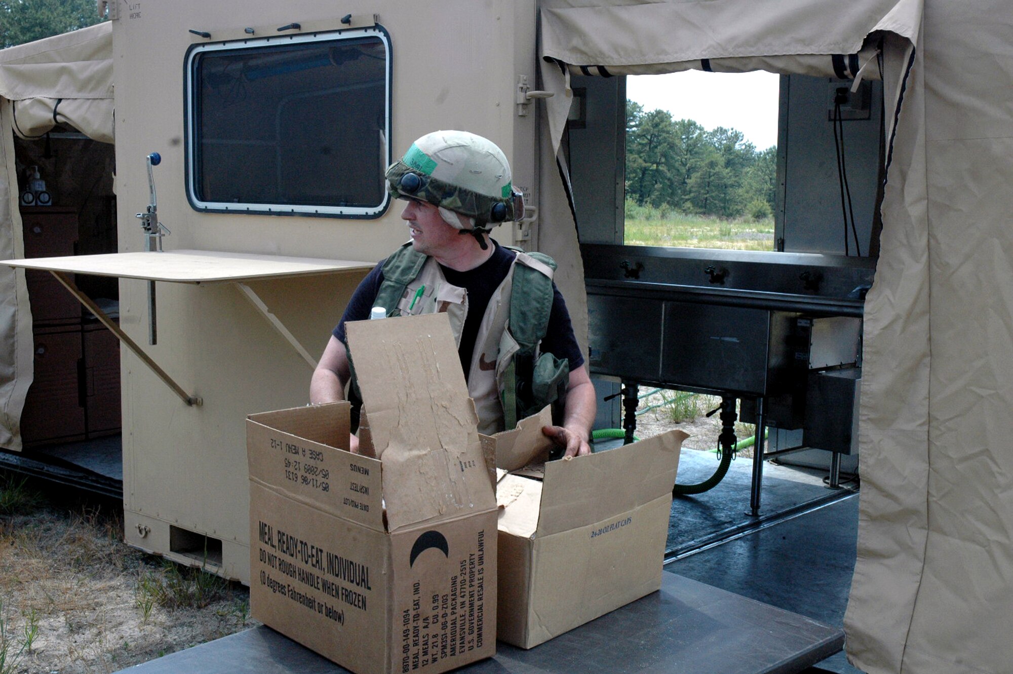 Staff Sgt. Lee Unick, from the 319th Force Support Squadron, Grand Forks Air Force Base, N.D., prepares boxes of meals-ready-to-eat, or MREs, for students deployed to Air Force Exercise Eagle Flag at Naval Air Engineering Station Lakehurst, N.J., June 21, 2008.  Eagle Flag is operated by the U.S. Air Force Expeditionary Center's Expeditionary Operations School and 421st Combat Training Squadron at Fort Dix, N.J.  The exercise tests and trains Airmen in expeditionary combat support skills.  (U.S. Air Force Photo/Tech. Sgt. Scott T. Sturkol)