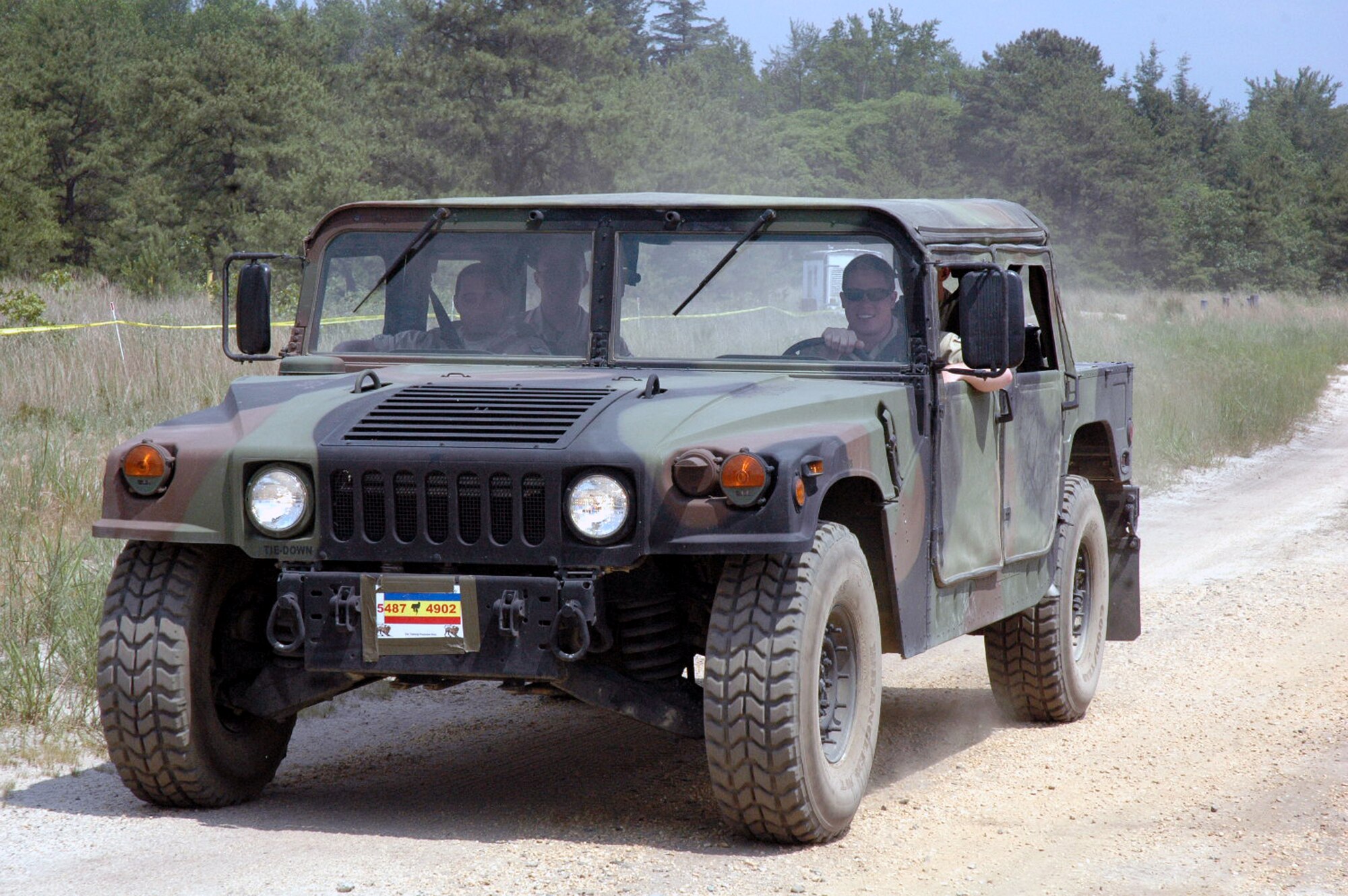 Role players for the "National Army of Chimaera" drive an HMMWV during Air Force Exercise Eagle Flag 08-5 operations at Naval Air Engineering Station Lakehurst, N.J., June 21, 2008.  They are a few of the numerous role players for the exercise whose job it is to make the exercise as realistic as possible.  Eagle Flag is operated by the U.S. Air Force Expeditionary Center's Expeditionary Operations School and 421st Combat Training Squadron at Fort Dix, N.J., and tests and trains Airmen in expeditionary combat support skills.  (U.S. Air Force Photo/Tech. Sgt. Scott T. Sturkol)