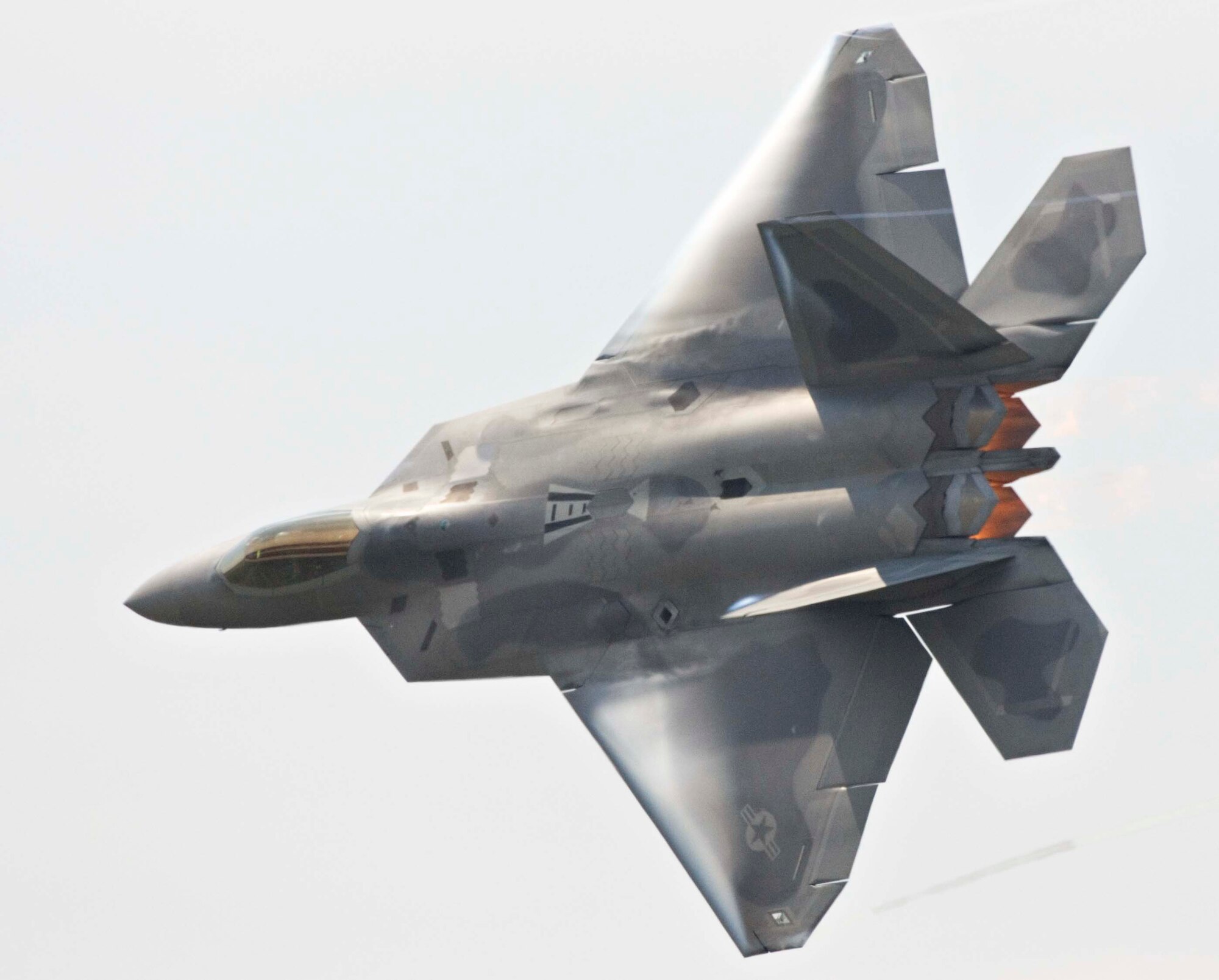 LANGLEY AIR FORCE BASE, Va. – An F-22A performs maneuvers during AirPower over Hampton Roads here June 21. Langley’s open house is an annual event that helps educate the public, increase recruiting and show appreciation to the local community. “It's a chance to get people informed, involved and excited,” said Lt. Col. Brady Merrill, director of AirPower over Hampton Roads and chief of 1st Fighter Wing Plans, Programs and Evaluations. (U.S. Air Force photo/Senior Airman Barry Loo)