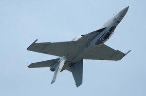 LANGLEY AIR FORCE BASE, Va. – An F-18 performs maneuvers during AirPower over Hampton Roads here June 21. Langley’s open house is an annual event that helps educate the public, increase recruiting and show appreciation to the local community. “It's a chance to get people informed, involved and excited,” said Lt. Col. Brady Merrill, director of AirPower over Hampton Roads and chief of 1st Fighter Wing Plans, Programs and Evaluations. (U.S. Air Force photo/Senior Airman Barry Loo)