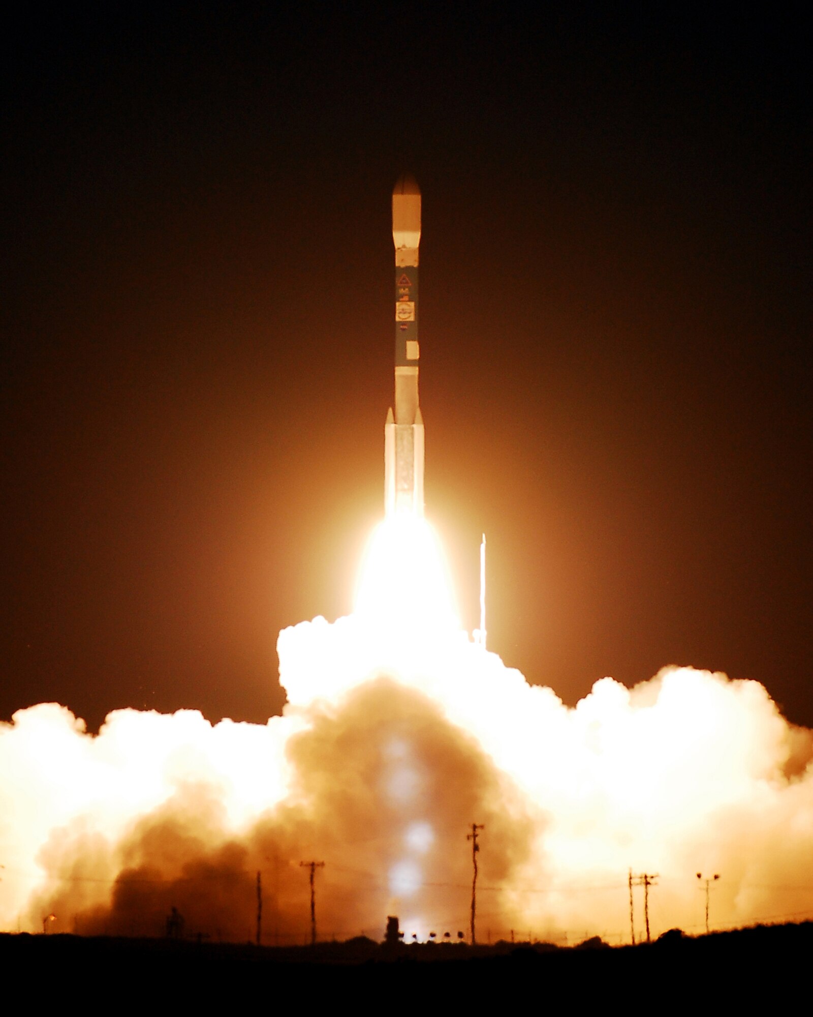 VANDENBERG AIR FORCE BASE, Calif., - Team Vandenberg successfully launches a Delta II rocket from Space Launch Complex-2 at 12:46 a.m. Friday. The rocket carried the OSTM/Jason-2 Satellite into an 830-mile near-circular orbit. The primary role of the spacecraft will be to measure and gather information about ocean topography. (U.S. Air Force photo/Joe Davila)