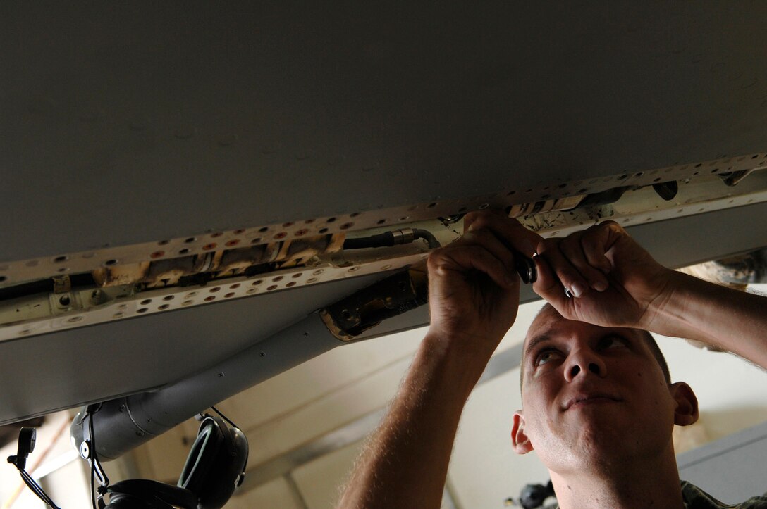 Airman 1st Class Shane Bridges reconnects a front leading edge actuator after it had been checked during a phase inspection of an F-16 Fighting Falcon June 18 at Joint Base Balad, Iraq. Ensuring the operability of the front leading edge flap is critical because the flap enhances the lift of the aircraft by creating an air channel under the wings, which provides more drag and allows the aircraft to maneuver during slower air speeds. Airman Bridges is a 332nd Expeditionary Aircraft Maintenance Squadron crew chief deployed from Shaw Air Force Base, S.C. (U.S. Air Force photo/Senior Airman Julianne Showalter) 