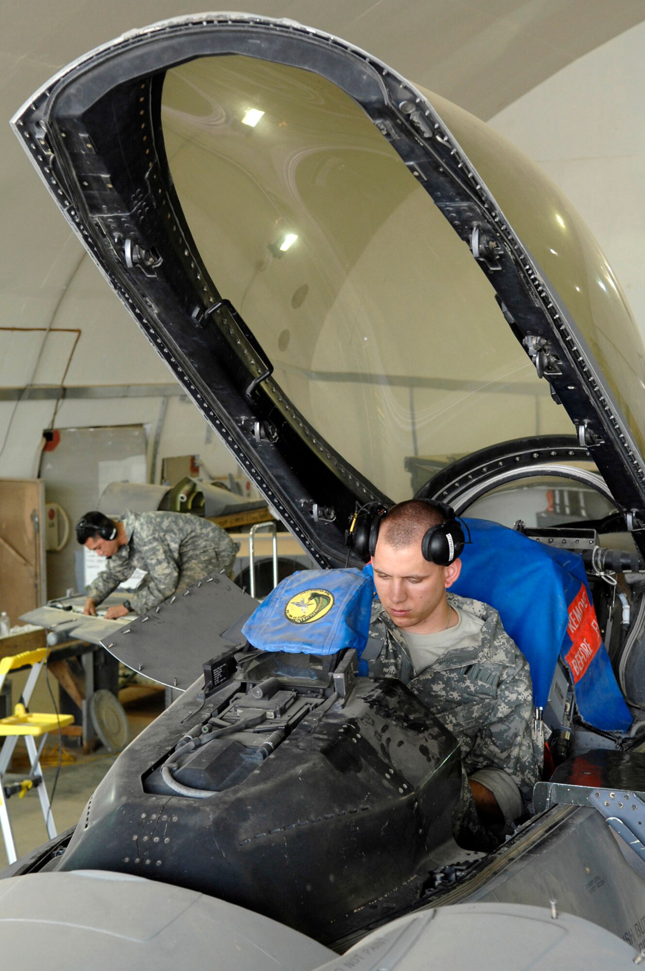 Airman 1st Class Shane Bridges goes through a checklist of items during a phase inspection of an F-16 Fighting Falcon June 18 at Joint Base Balad, Iraq. A phase inspection checks critical aircraft systems to ensure they are in working order and can continue to fly combat missions over Iraq. Airman Bridges is a 332nd Expeditionary Aircraft Maintenance Squadron crew chief deployed from Shaw Air Force Base, S.C. (U.S. Air Force photo/Senior Airman Julianne Showalter) 
