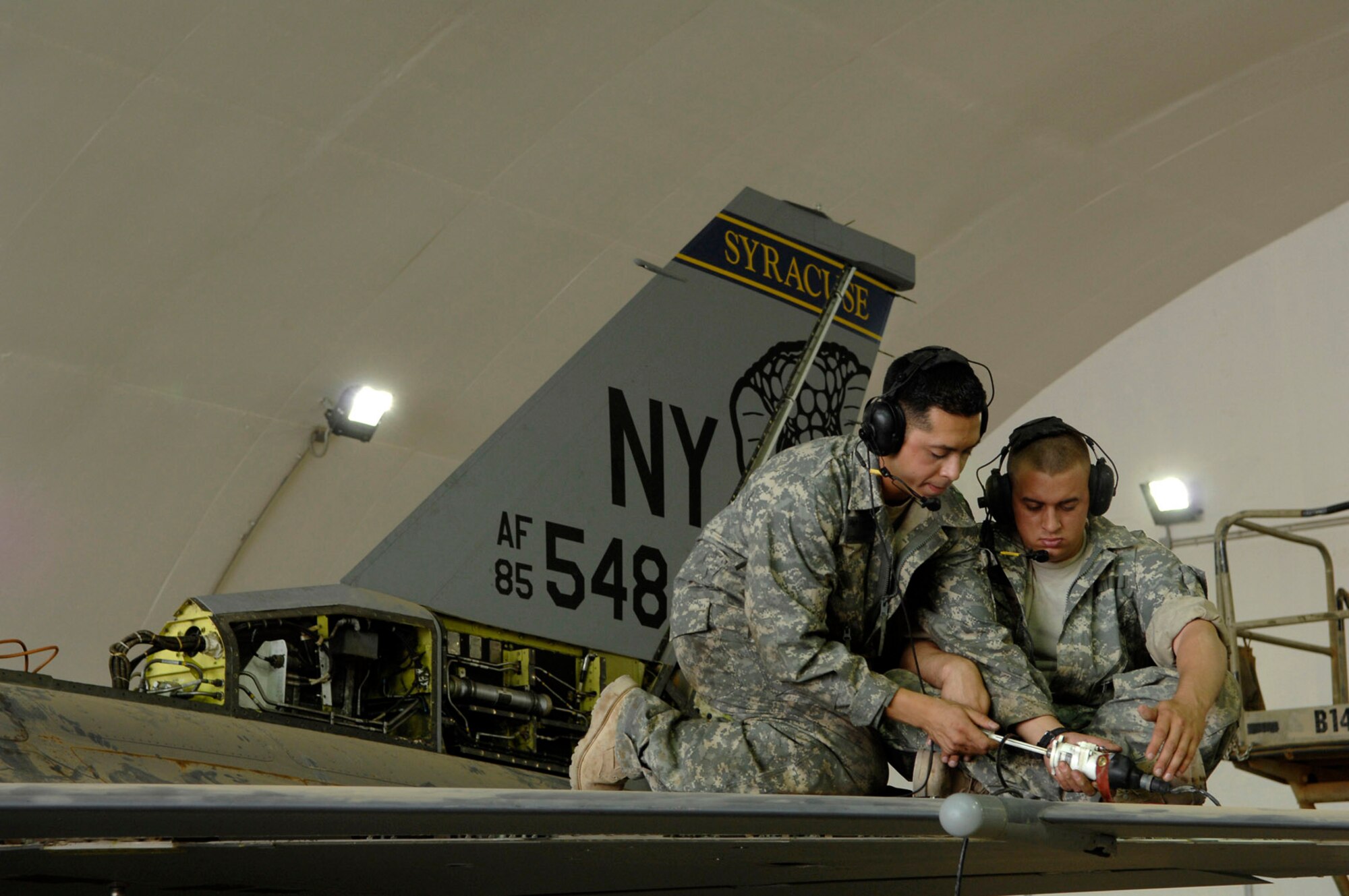 Staff Sgt. Caesar Rivera and Airman 1st Class Bryan Boswell test an actuator, a device used to control aircraft flaps, on an F-16 Fighting Falcon during a phase inspection June 18 at Joint Base Balad, Iraq. The leading edge flap, which the actuator controls, provides additional lift and drag during takeoff and landing. Sergeant Rivera and Airman Boswell are 332nd Expeditionary Aircraft Maintenance Squadron crew chiefs and both are deployed from Nellis Air Force Base, Nev. (U.S. Air Force photo/Senior Airman Julianne Showalter) 
