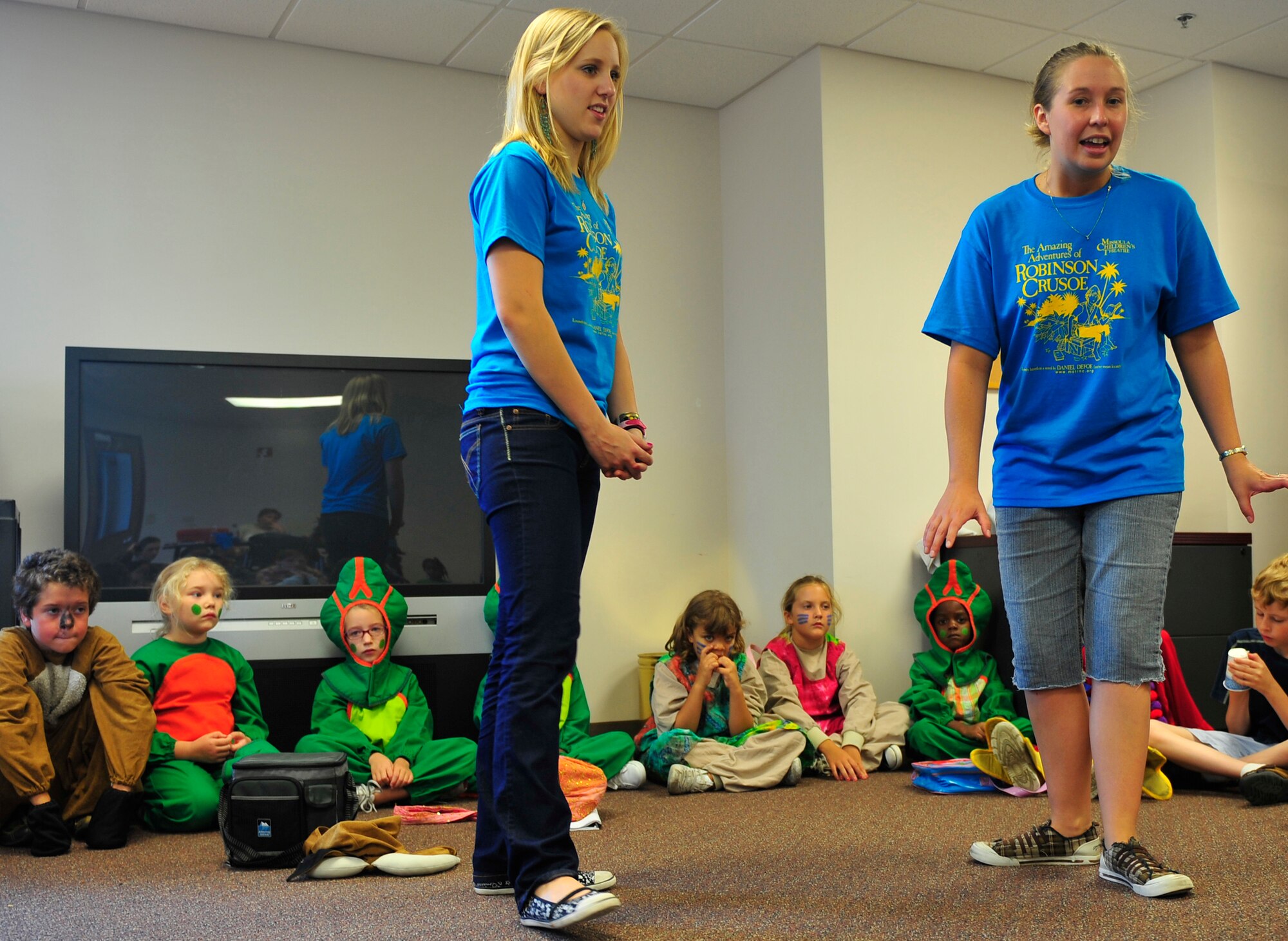 MOODY AIR FORCE BASE, Ga -- 
Chloe Edmonson and Lindsay Arthur, Missoula Children's Theatre tour actor directors. practice songs with the children here June 20. This is the seventh year the theatre company has been invited back to Moody Air Force Base to host a week-long camp. (U.S. Air Force photo by Senior Airman Schelli Jones)