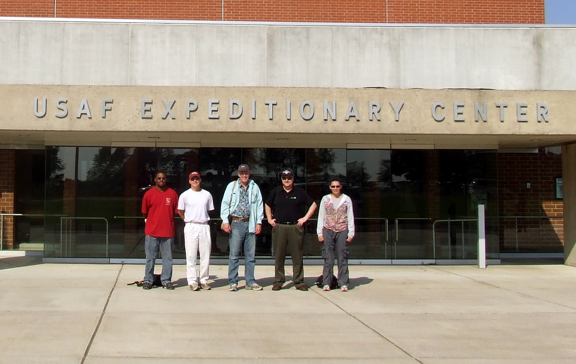 Artists Steven Walker, James Bennett, John Finger, William Frake and Tatiana El Khouri stand in front of the U.S. Air Force Expeditionary Center on Fort Dix, N.J. during their visit to the Center to document the Air Force Phoenix Warrior Training Course for the Air Force Art Program June 20, 2008.  They visited the USAF EC and its courses to create future works of art for the program.  (U.S. Air Force Photo/Tech. Sgt. Scott T. Sturkol)
