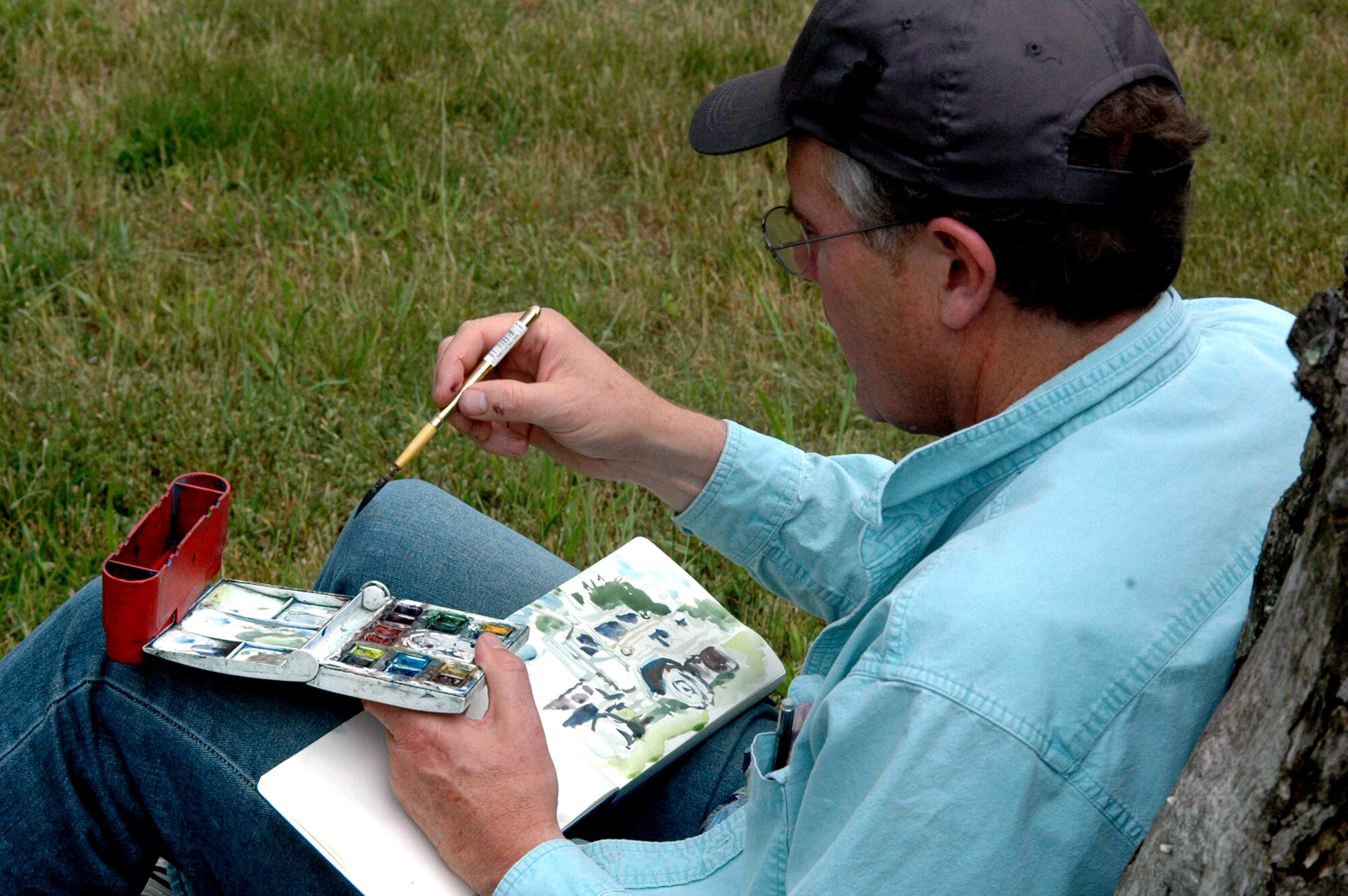Artist John Finger of Walnut Creek, Calif., paints a scene during a visit to a Fort Dix, N.J., range to document the Air Force Phoenix Warrior Training Course for the Air Force Art Program June 20, 2008.  He was one of five artists visiting the U.S. Air Force Expeditionary Center and its courses to create future works of art for the program.  (U.S. Air Force Photo/Tech. Sgt. Scott T. Sturkol)
