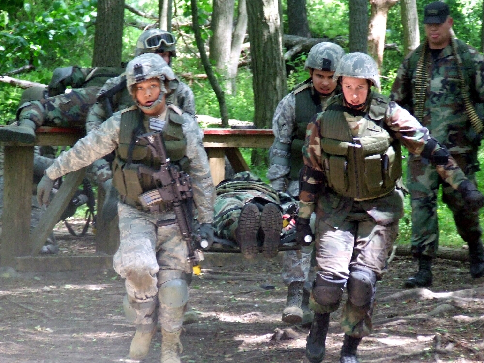 Students in the Air Force Phoenix Warrior Training Course participate in a combat first aid  class on a Fort Dix, N.J., range June 19, 2008.  The course is taught by the U.S. Air Force Expeditionary Center's Expeditionary Operations School and 421st Combat Training Squadron and prepares security forces Airmen for upcoming deployments.  (U.S. Air Force Photo/Tech. Sgt. Scott T. Sturkol)
