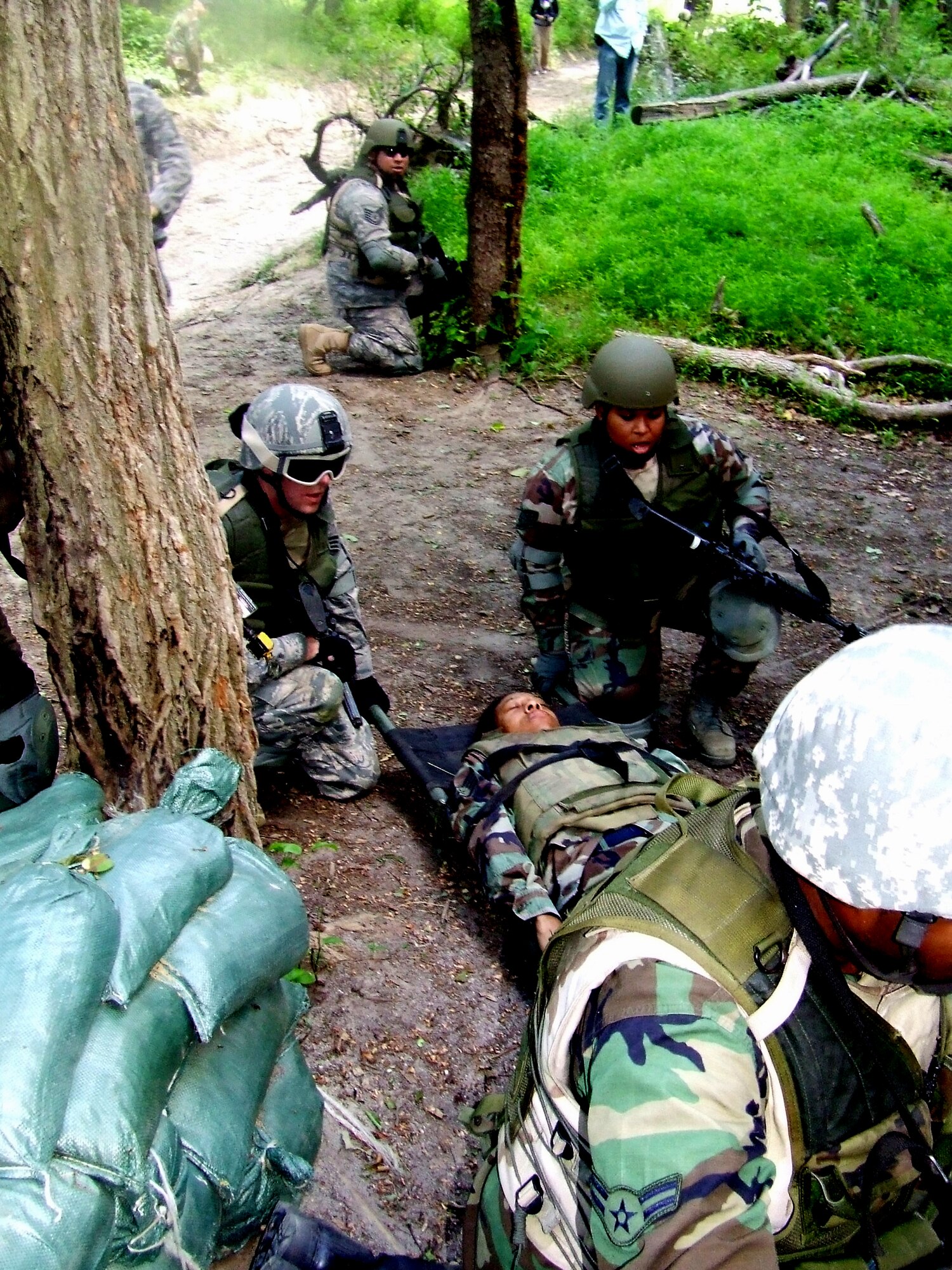 Students in the Air Force Phoenix Warrior Training Course participate in a combat first aid  class on a Fort Dix, N.J., range June 19, 2008.  The course is taught by the U.S. Air Force Expeditionary Center's Expeditionary Operations School and 421st Combat Training Squadron and prepares security forces Airmen for upcoming deployments.  (U.S. Air Force Photo/Tech. Sgt. Scott T. Sturkol)