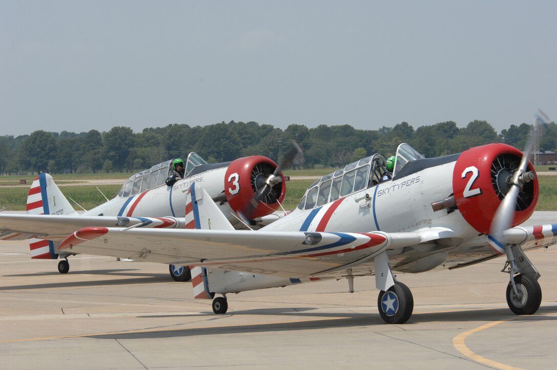 LANGLEY AIR FORCE BASE, Va. -- The GEICO Skytypers taxi down the runway in their vintage World War II SNJ-2 airplanes after their performance at AirPower over Hampton Roads June 22. Langley’s open house is an annual event that helps educate the public, increase recruiting and show appreciation to the local community. (U.S. Air Force photo/Tech. Sgt. April Wickes)