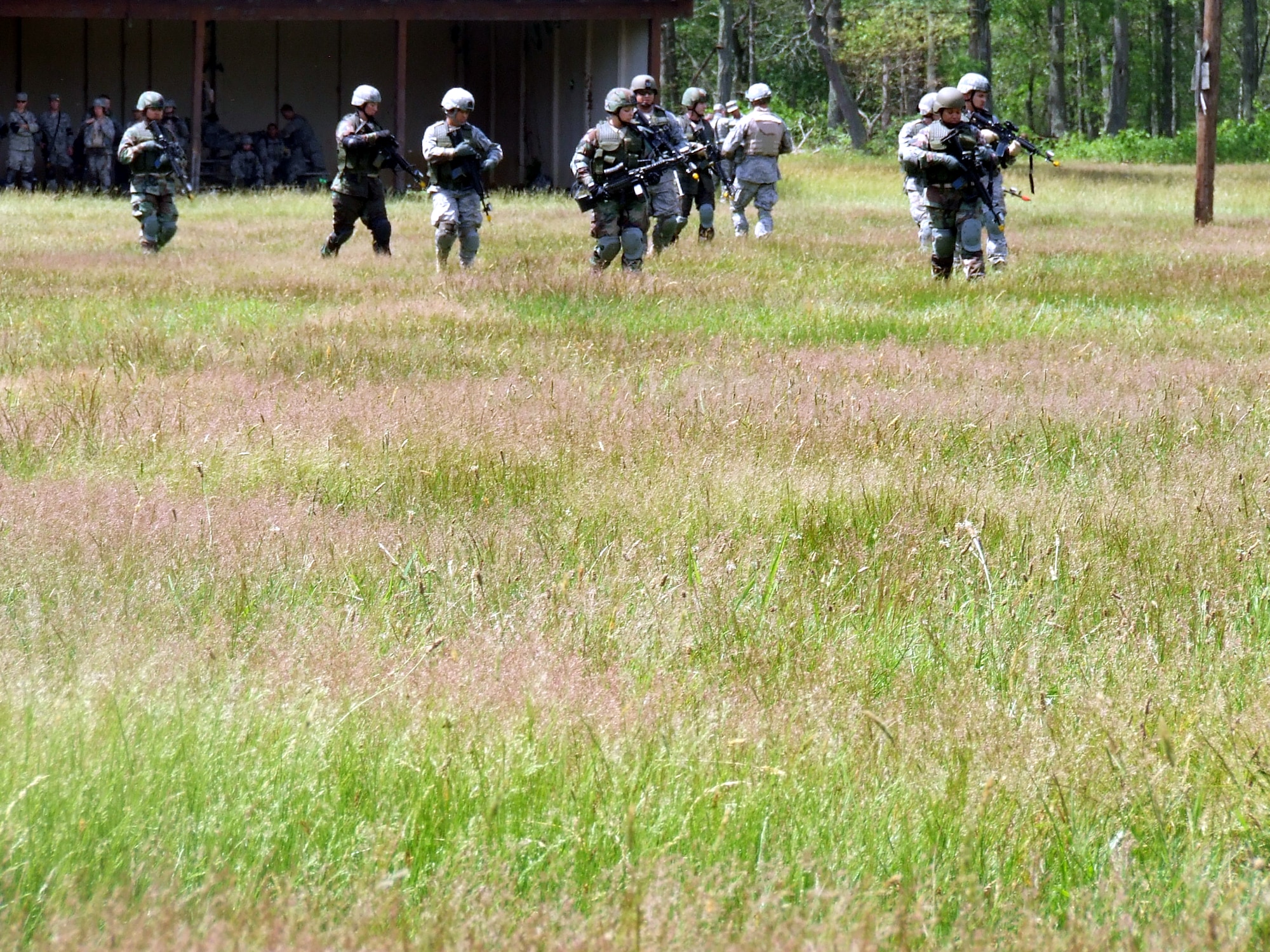 Students in the Air Force Phoenix Warrior Training Course walk in formation during the start of a run through the combat first aid course on a Fort Dix, N.J., range June 19, 2008.  The course is taught by the U.S. Air Force Expeditionary Center's Expeditionary Operations School and 421st Combat Training Squadron and prepares security forces Airmen for upcoming deployments.  (U.S. Air Force Photo/Tech. Sgt. Scott T. Sturkol)