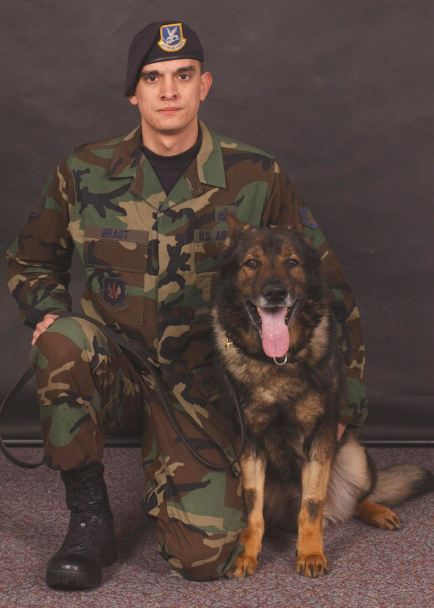 Staff Sgt, Phillip Bradt, 100th Security Forces Squadron Military Working Dog Section, was War's last handler, and said his partner's death has hit him hard. "I'll forever remember coming in, and as soon as War set eyes on me, or heard my voice, he was ready to go. And when I say 'ready' I mean ready! It was difficult to even put his collar and leash on him," he said. "War was my partner, and most of all, my friend." (U.S. Air Force photo by Airman 1st Class Brad Smith)                                      