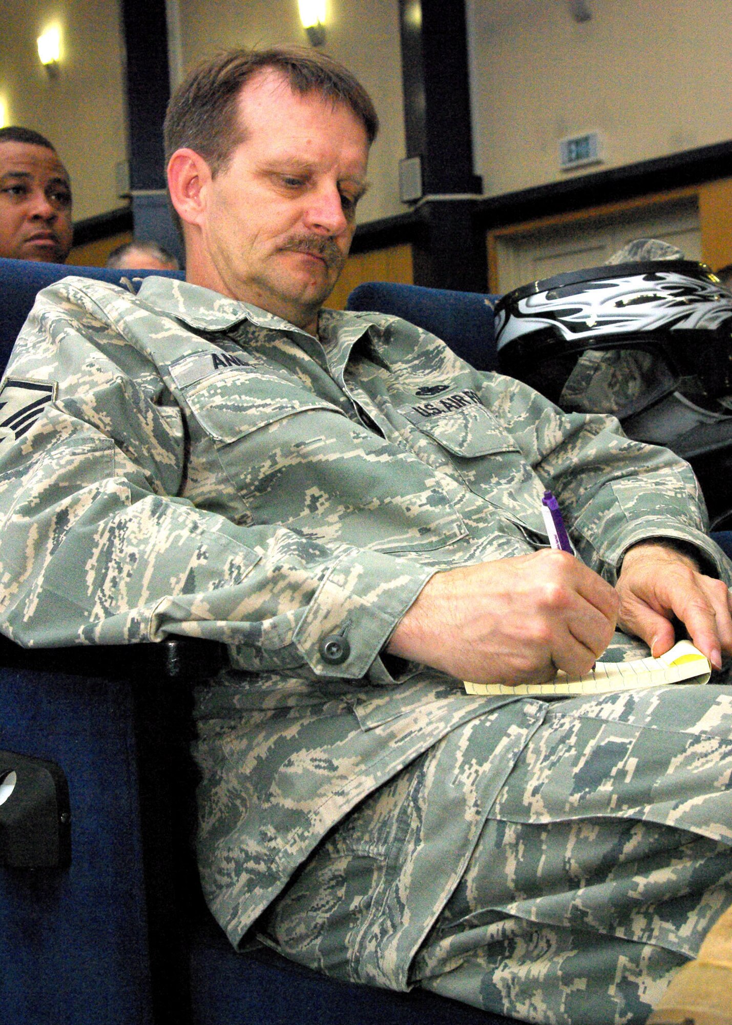 SPANGDAHLEM AIR BASE, Germany -- Master Sgt. Lawrence Anderson, 52nd Operations Support Squadron first sergeant, takes notes on the changes being implemented to Spangdahlem Air Base's Mission Support Flight. (U.S. Air Force photo by Staff Sgt. Matthew S. Bright.)