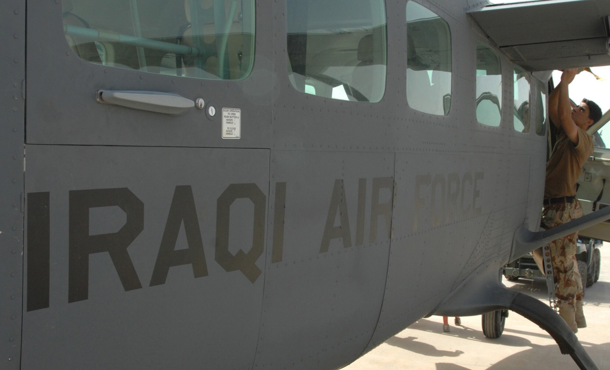 KIRKUK REGIONAL AIR BASE, Iraq - An Iraqi Airmen performs maintenance on a 3rd Squadron Cessna 208 recently here. While Iraqi air force pilots continue flying sorties to aid stability in their nation, Iraqi maintainers on the ground here have recently achieved important benchmarks to keep their fleet in the air. Airmen with the Iraqi air forces’ 3rd Squadron here recently took over a wide variety of maintenance duties on the unit’s Cessna 208 Caravan Intelligence, Surveillance and Reconnaissance fleet – a task formerly performed by U.S. contractors. (U.S. Air Force photo by Senior Airman Eric Schloeffel)