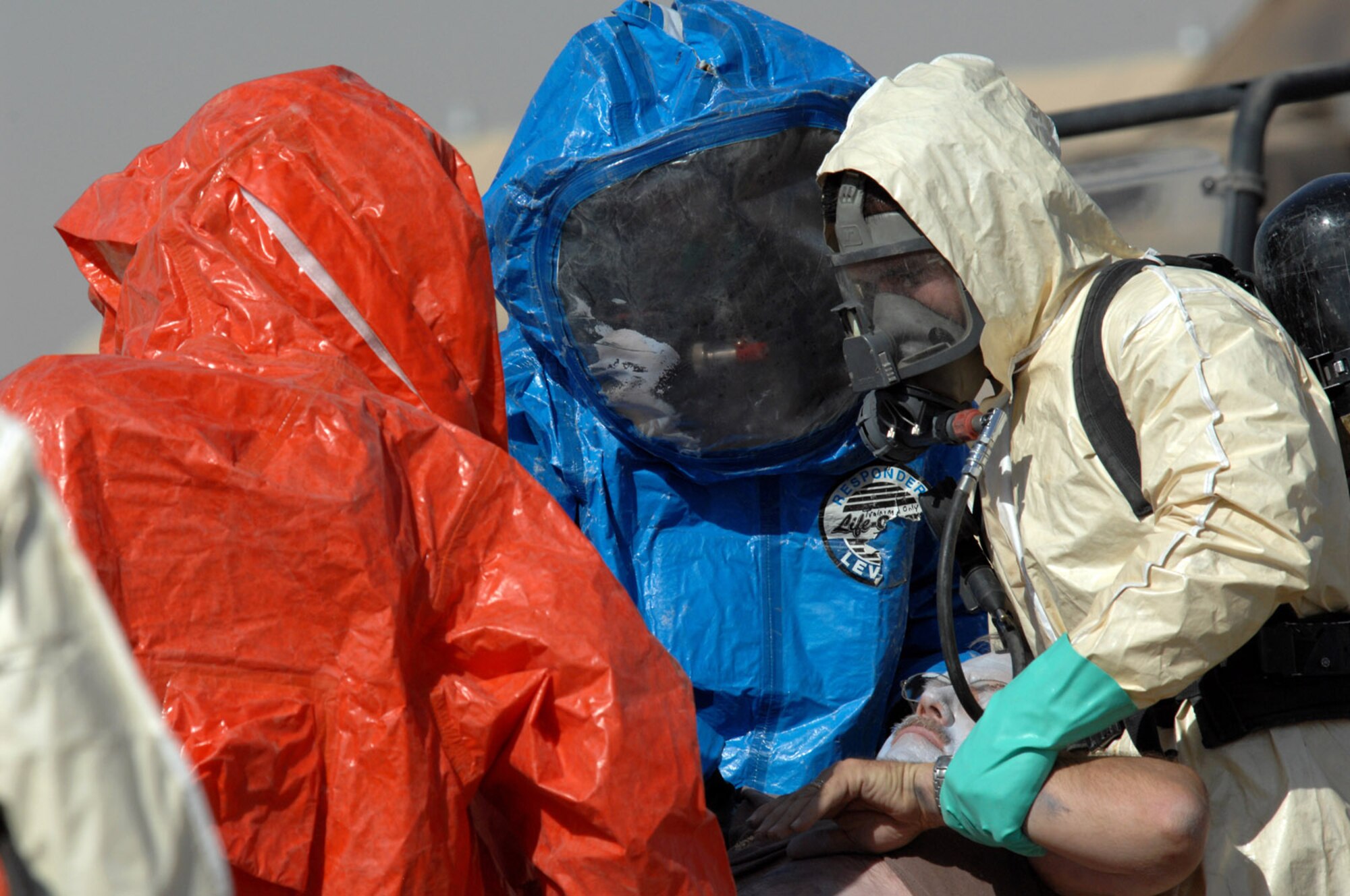 KIRKUK REGIONAL AIR BASE, Iraq – Airmen from the 506th Air Expeditionary Group participate in a base exercise involving casualties and hazardous materials June 20 here. The exercise tested the abilities of several base agencies to respond in the event of a disaster. (U.S. Air Force photo by Senior Airman SerMae Lampkin)