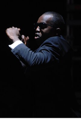 Tops in Blue dancer Staff Sgt. Corey Sims performs a hip-hop number to the "Men in Black" theme song during this year's Tops in Blue concert held at the Rushmore Plaza Civic Center in Rapid City, S.D., June 19. Tops In Blue is the Air Force's premier entertainment showcase which brings together the best in music, dance and comedy. (U.S. Air Force photo/Airman Corey Hook)