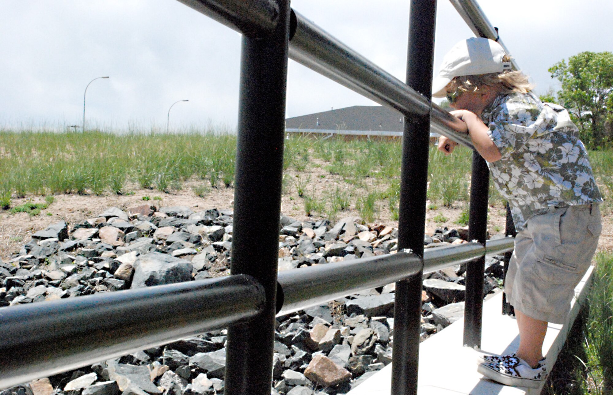 Kai Tuinman, son of the 37th Helicopter Squadron’s Capt. Bryan Tuinman, takes a break from the Best Father’s Day Ever activities Sunday to throw rocks toward a drainage ditch near the Trail’s End Club parking lot (Photos by Airman 1st Class Daryl Knee).