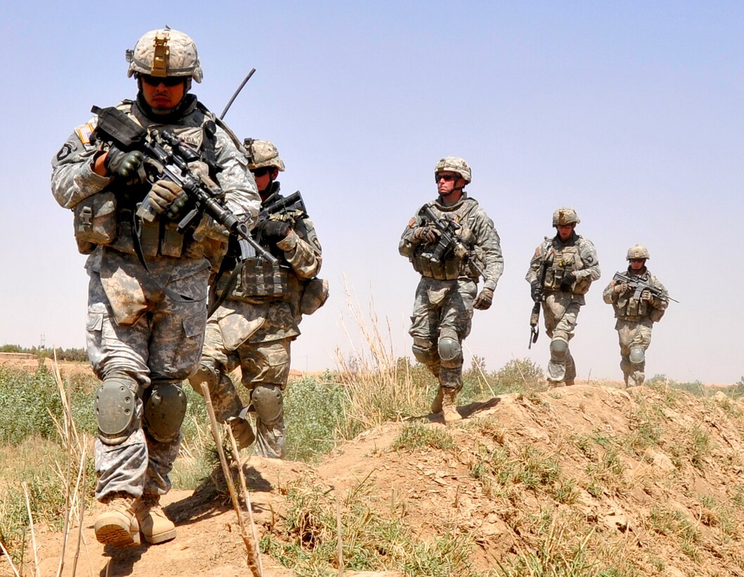 US Army Staff Sgt Miguel Miranda Leads A Patrol Along The Tigris