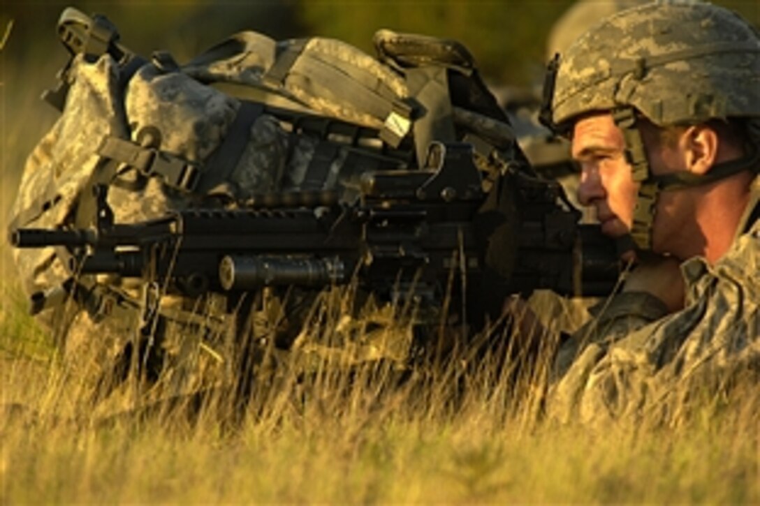A U.S. soldier assigned to the 82nd Airborne Division provides security during a joint forcible entry exercise on Fort Bragg, N.C., June 17, 2008. The exercise is designed to enhance cohesiveness between Army and Air Force personnel by training both services on how to execute large-scale heavy equipment and troop movement. 
