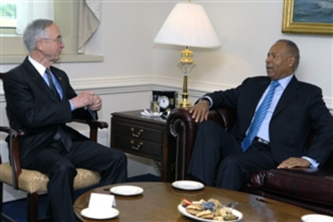 U.S. Deputy Defense Secretary Gordon England, left, talks with Trinidad Tobago Prime Minister Patrick Manning during a meeting inside the Pentagon, June 23, 2008.  