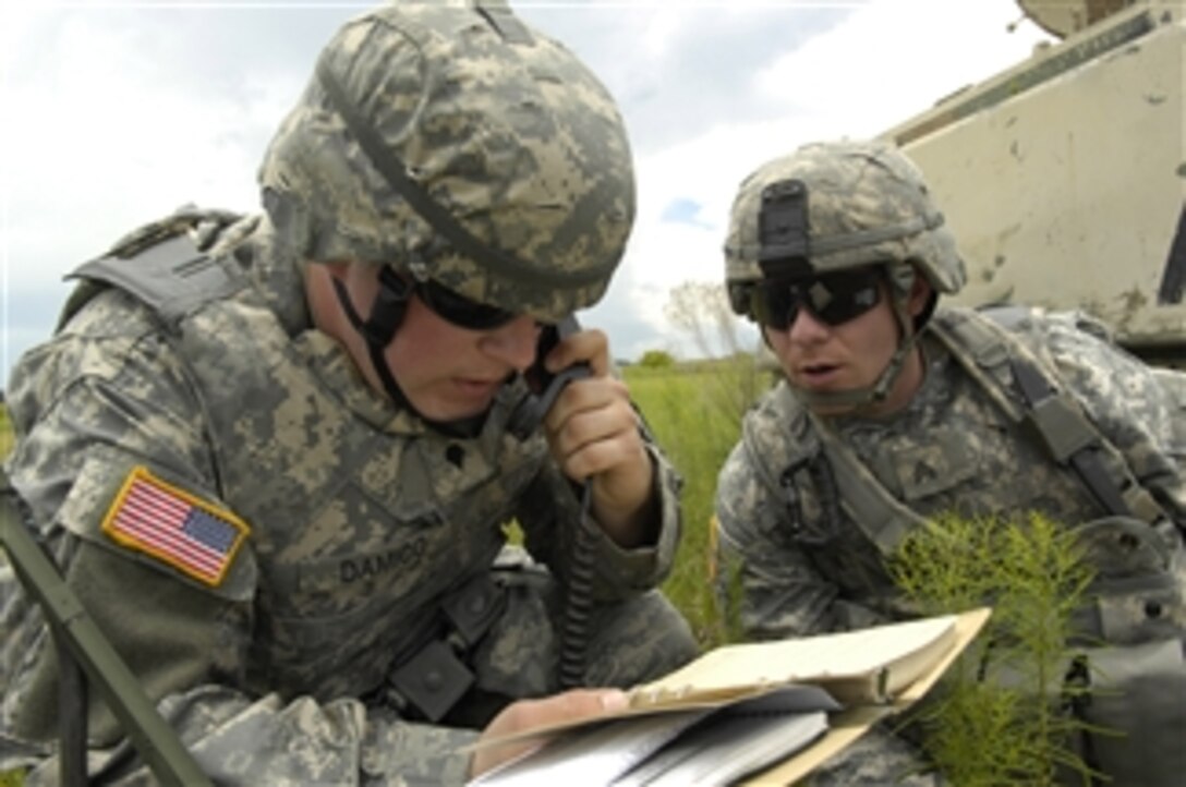 U.S. Army Spc. James D'Amico and Sgt. Timothy Boggs from the 1st Stryker Brigade Combat Team, 25th Infantry Division call for support from air assets during Atlantic Strike VII at Avon Park Air Ground training Complex in Avon Park, Fla., on June 18, 2008.  Atlantic Strike is a joint forces training exercise involving Joint Terminal Attack Controllers from the U.S. Army, Air Force and Marines.  