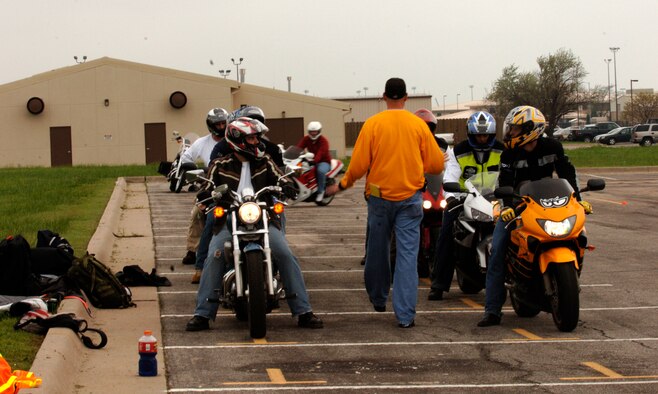 MCCONNELL AIR FORCE BASE, Kan. -- A basic riding course instructor guides his class back to their starting line after they perform a few last maneuvers. The class spent an entire day of riding in a parking lot on base, in order to practice some of their newly learned safety oriented skills. (Photo by Airman Justin Shelton)