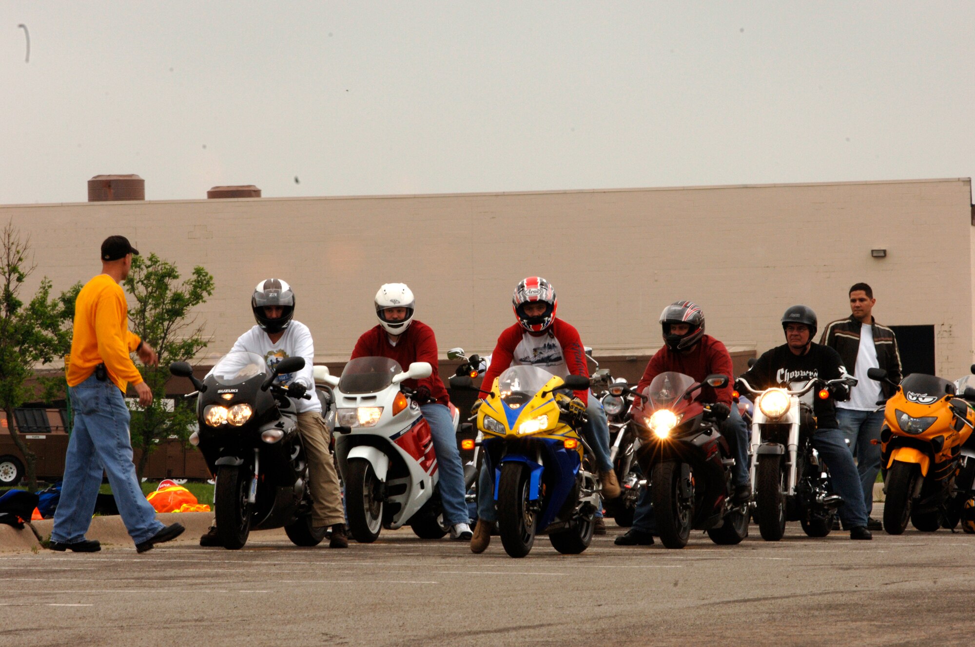 MCCONNELL AIR FORCE BASE, Kan. -- A basic riding course instructor lines the class of riders up in order to start their maneuvering practice. Members from all over McConnell, including the Air Force Guard and the Army participated in the class, exhibiting different skills that had been taught to them by the base safety office. (Photo by Airman Justin Shelton)