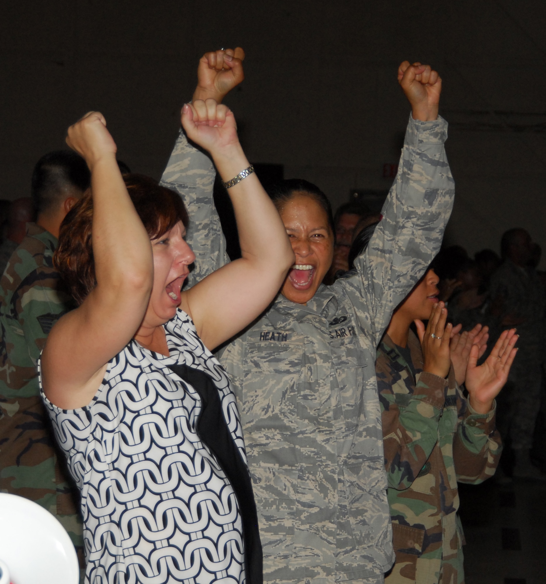 Chief Master Sgt. Arleen Heath, 325th Operations Group superintendent, and Mrs. Barbara Heckerson, 325th Operations Group secretary, join wing personnel in celebrating the results of the AETC Operational Readiness Inspection at an ORI out brief here today. (U.S. Air Force photo/Lisa Norman)
