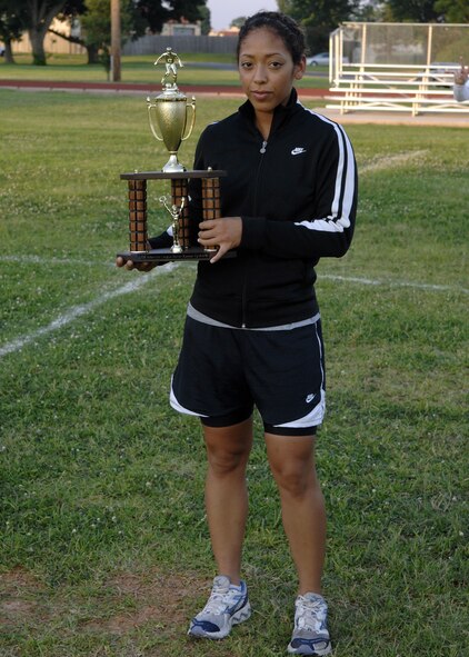 BARKSDALE AIR FORCE BASE, La.- Senior Airman Stephanie Moreno accepts the 2008 American League soccer runner up trophy for the 2d Security Forces Squadron soccer team at the Barksdale fitness center field June 19, 2008. (US Air Force Photo by Amn Benjamin McWha)